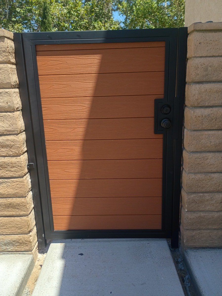 Custom steel pedestrian gate with composite wood-look slats