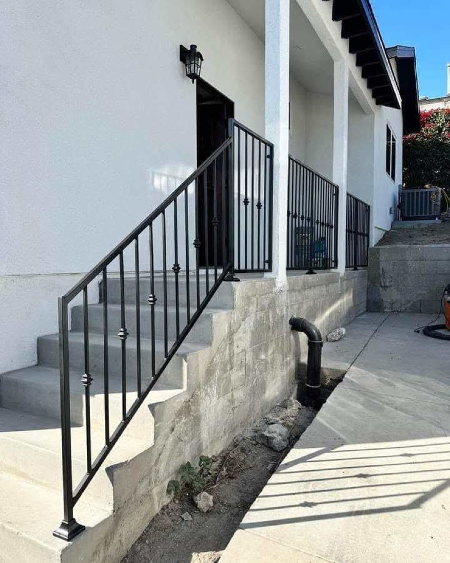 Exterior steel handrail on stucco entry steps