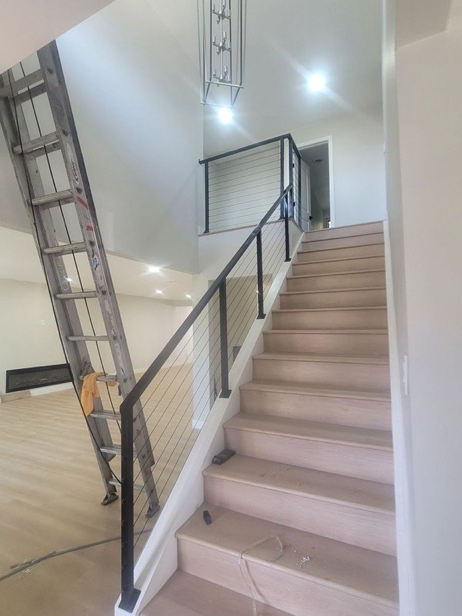 Interior staircase with steel cable railing