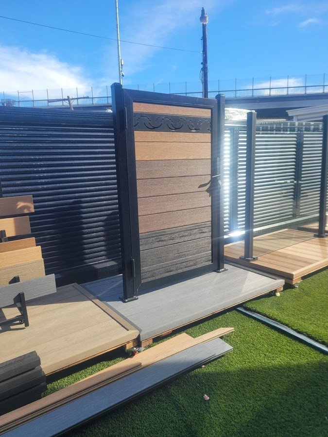 Modern horizontal slat fence with wood accent