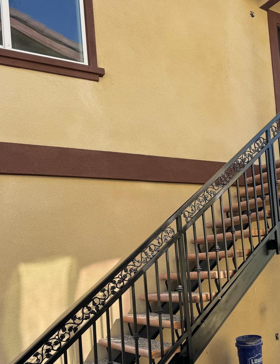 Custom ornate scrollwork steel staircase railing